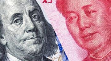 Юань показал рекордное годовое падение по отношению к доллару